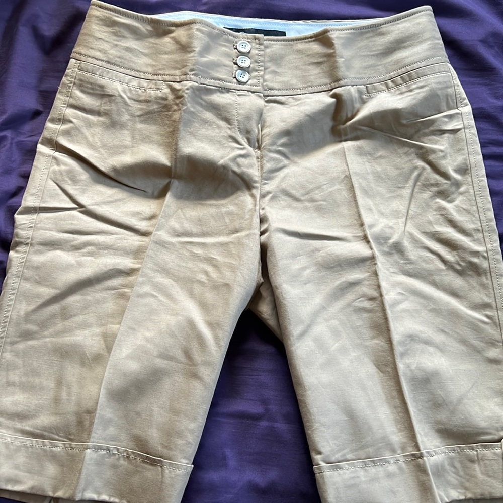 Tan, above the knee-style shorts. Never worn or washed.  Size 6.